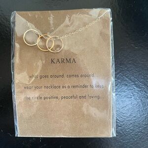 KARMA "WHAT GOES AROUND. COMES AROUND" GOLD TONE NECKLACE